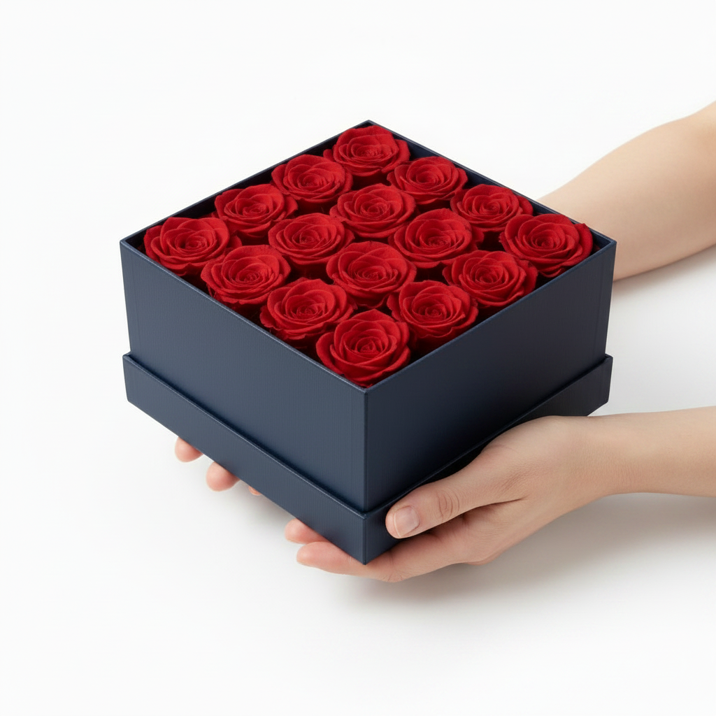 Caja de rosas rojas en mano